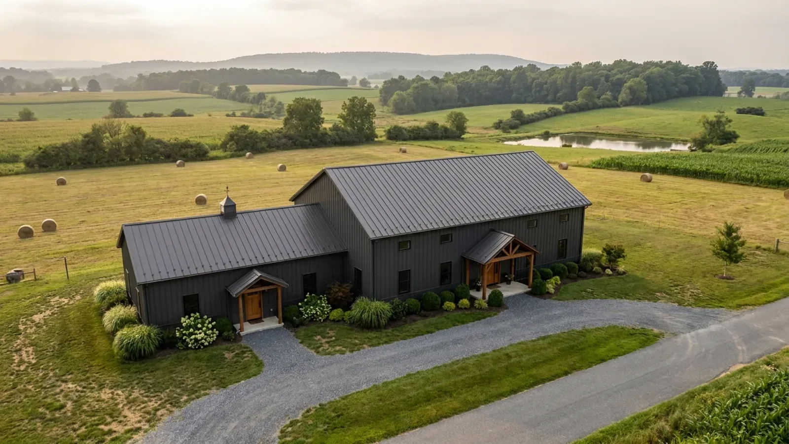 A barndominium with a smaller attached in-law suite wing that has its own separate covered entry, distinct from the main entry.
